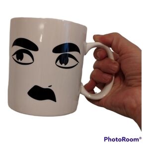 Andrea Vecera designed facial expression coffee mug
